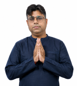 Ankur Saxena, founder of Ankur Arise, greeting with a traditional Namaste gesture in a blue kurta.